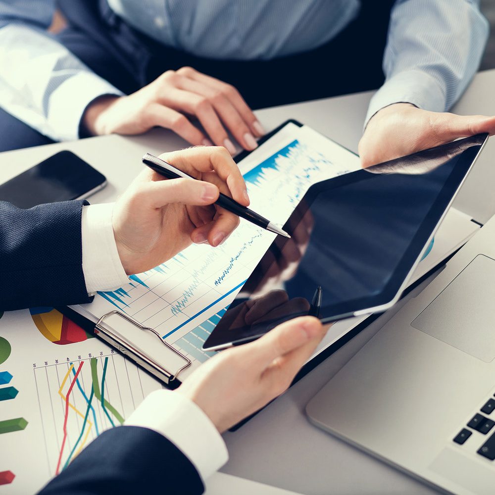 Businessman and businesswoman uses digital tablet Businessman and businesswoman uses digital tablet in office